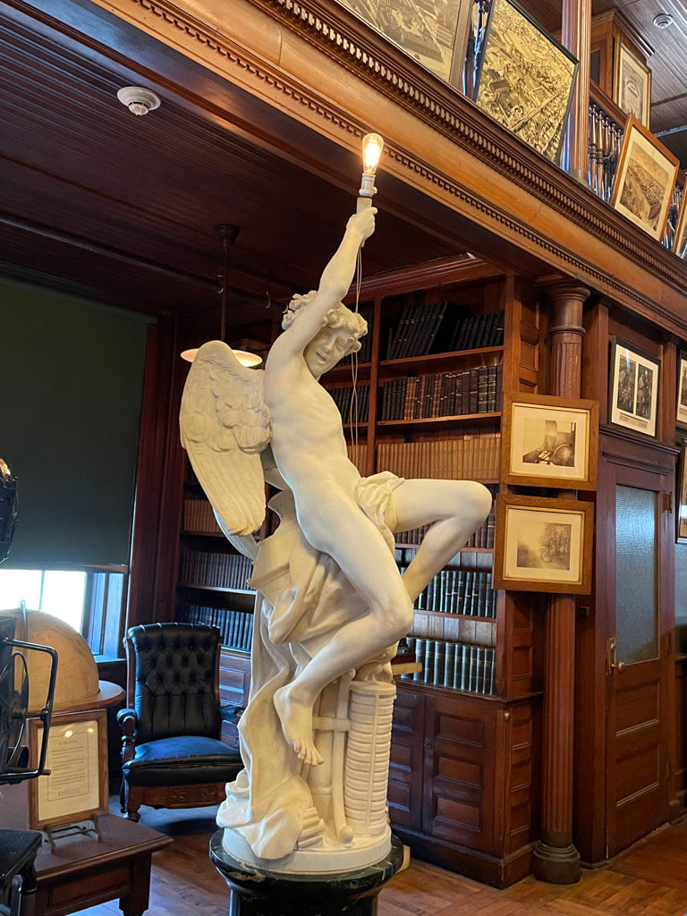 Statue holding light at Thomas Edison Library